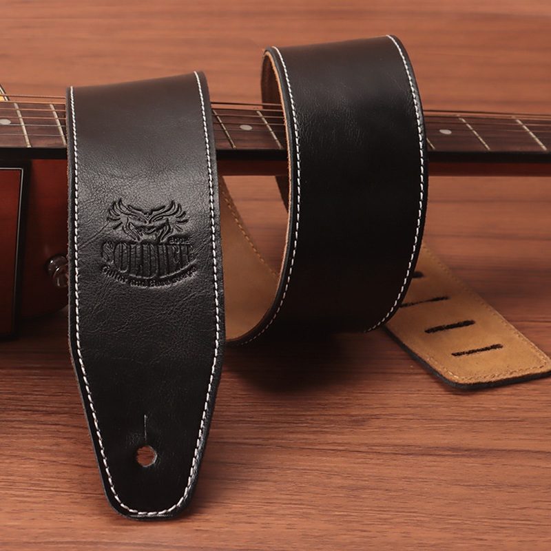 Black Soldier cowhide guitar strap with white contrast stitching