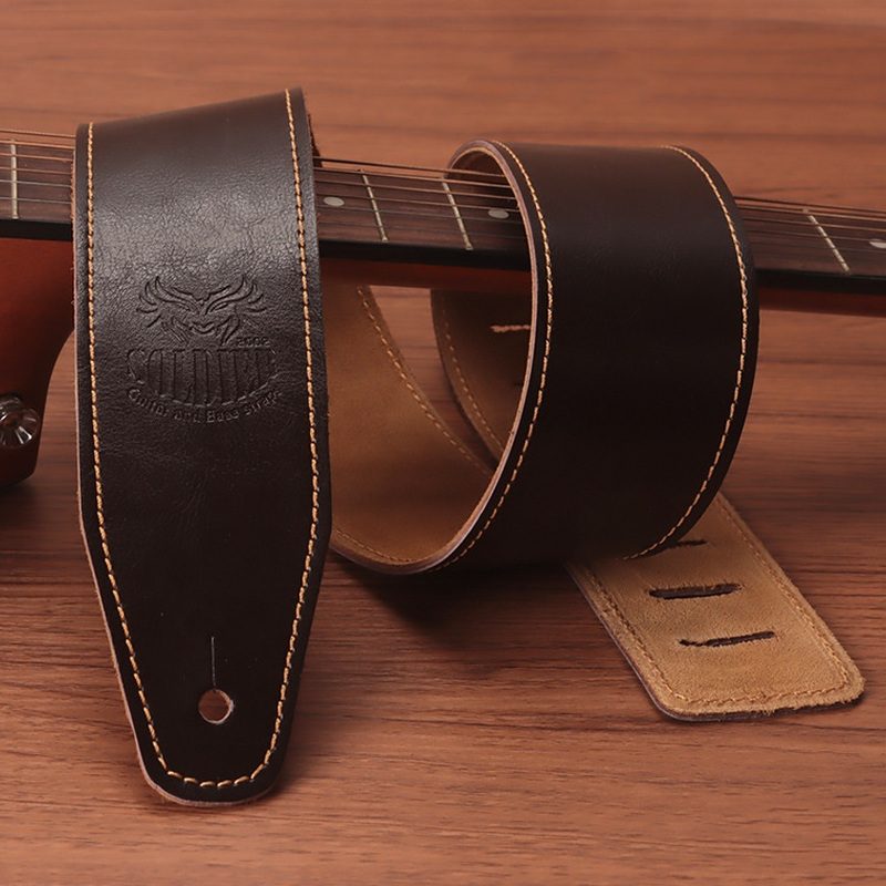 Dark brown Soldier cowhide guitar strap showing the suede-finish back