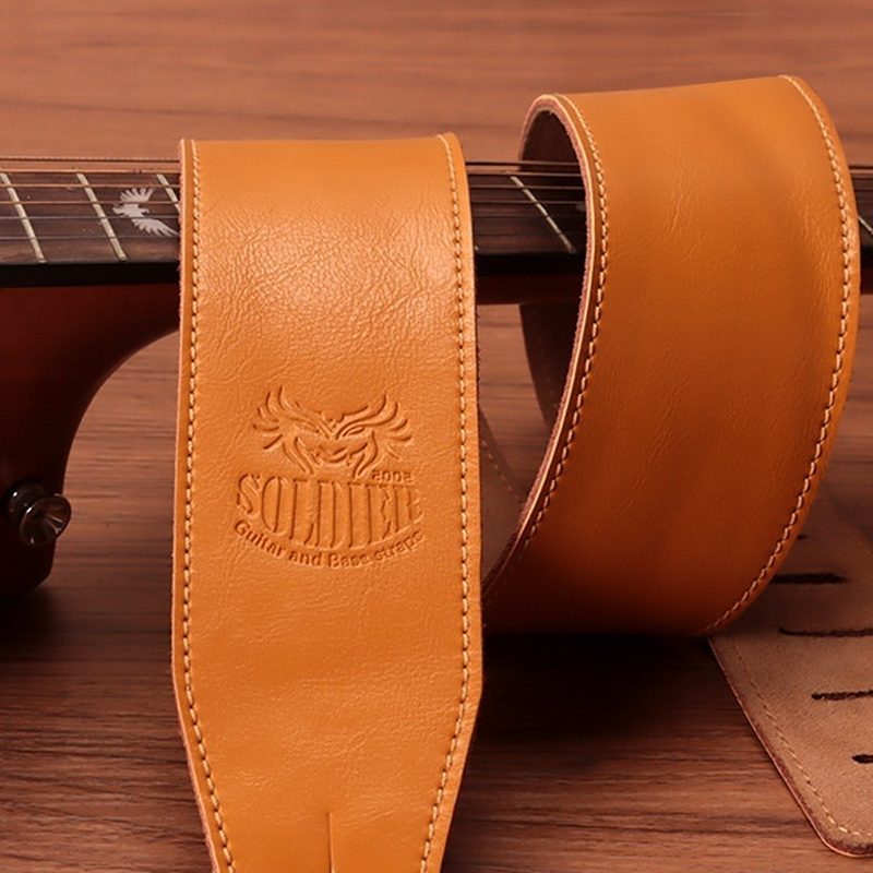 The maker logo embossed into the leather, above the contrast stitching
