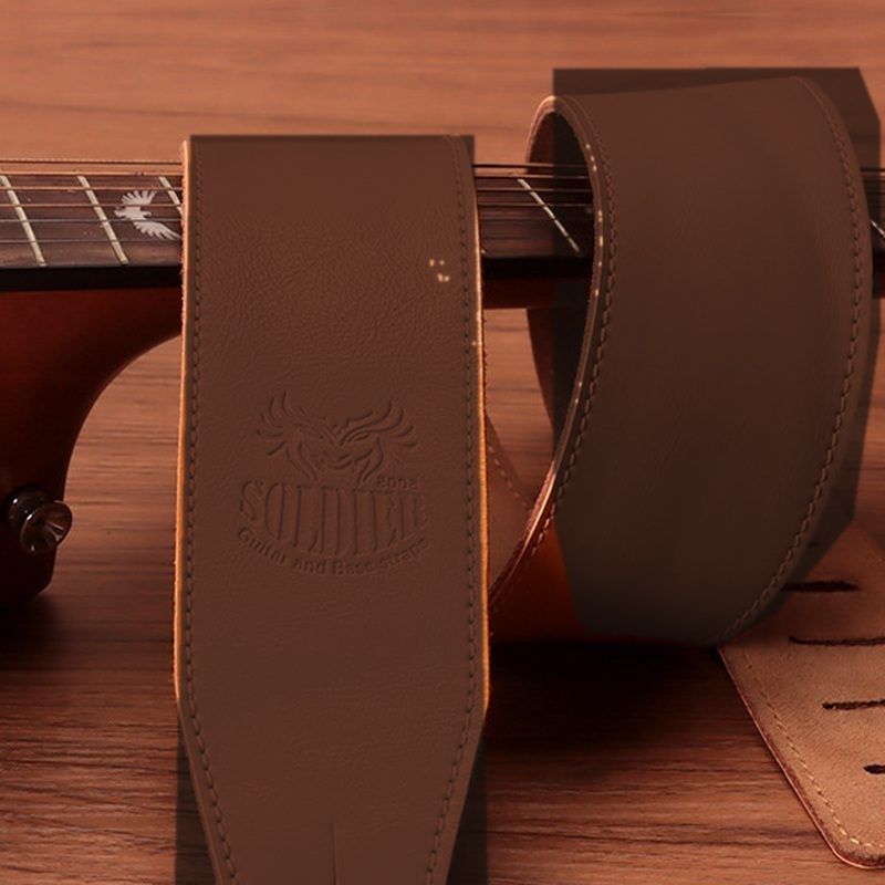 The maker logo embossed into the leather, shown in dark brown