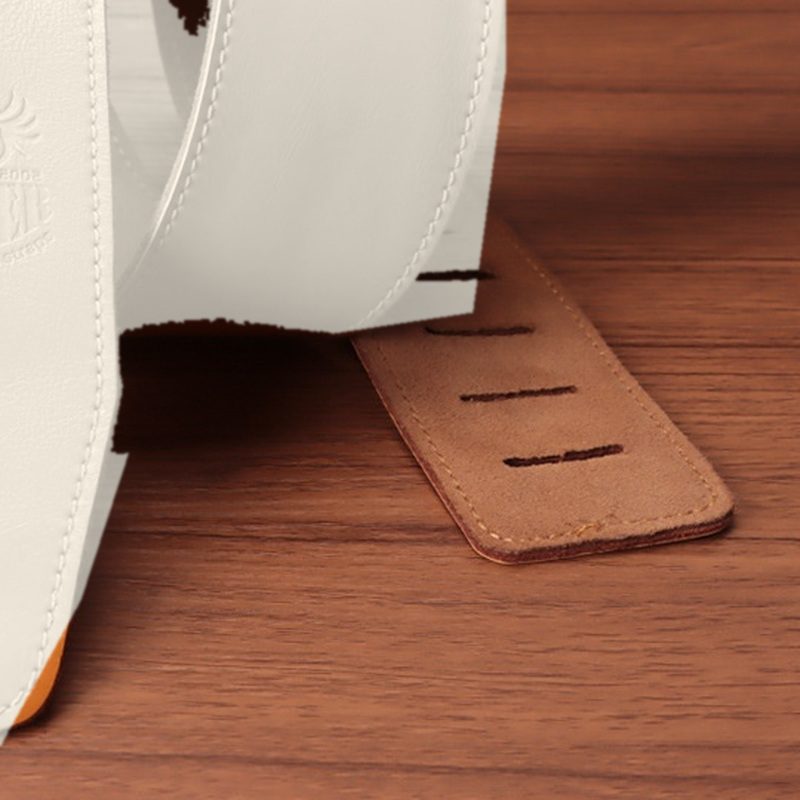 The suede-finish back of the tail beside the strap face, shown in white