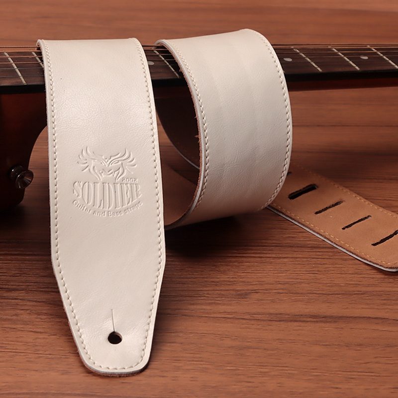White Soldier cowhide guitar strap with contrast stitching