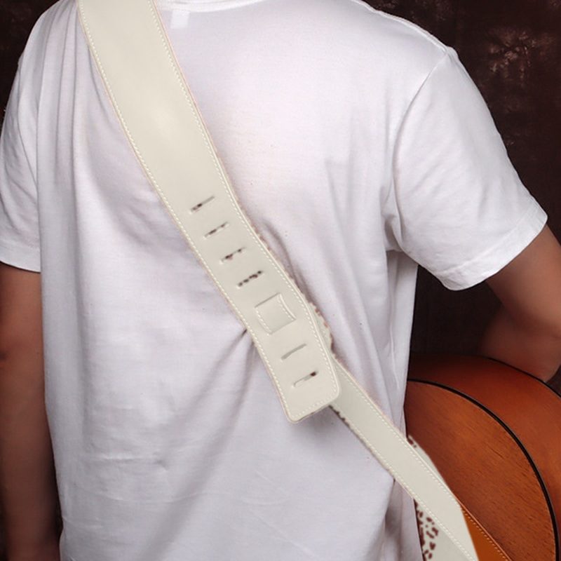 The strap worn over the shoulder, shown in white
